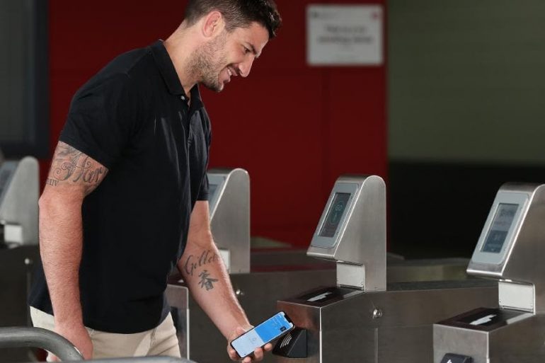 Brisbane and Queensland rugby league player Matt Gillett with the contactless ticket on an iPhone at Suncorp Stadium